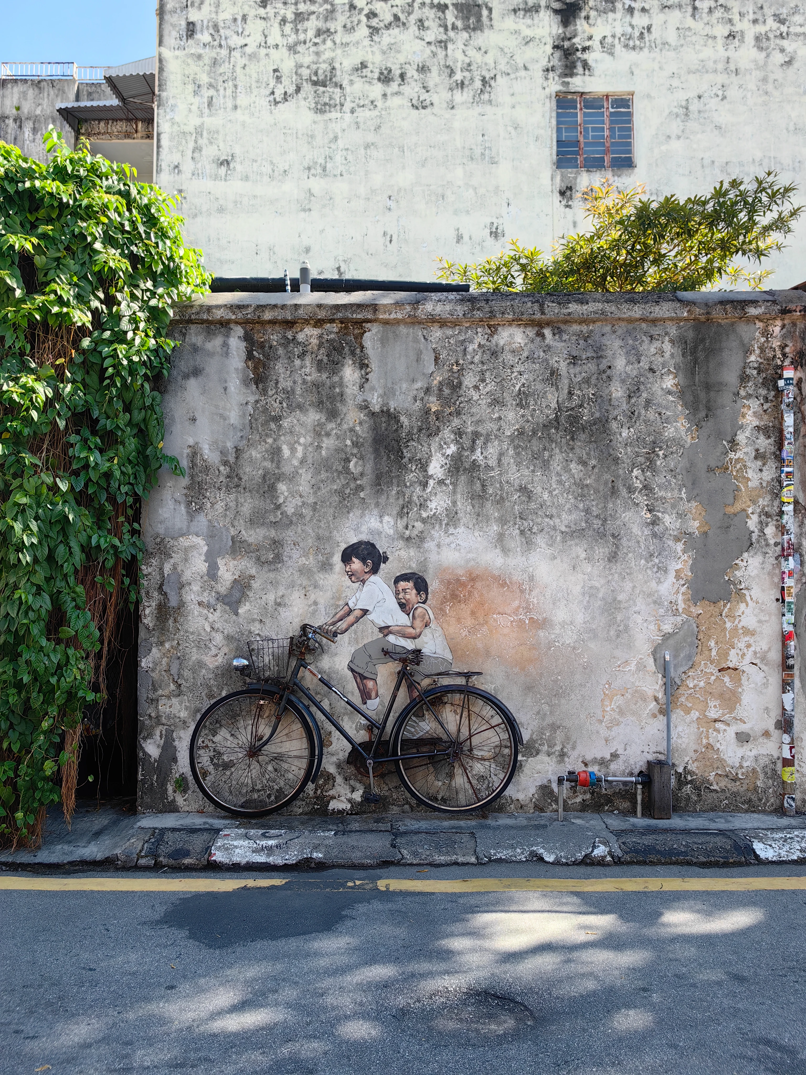 Street art – Penang, mural z rowerem